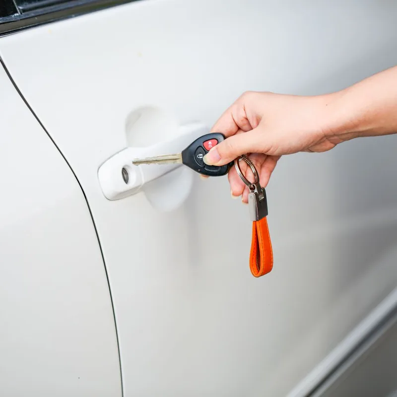 Kama'aina Locksmith unlocking a car door with a car key and remote fob in Honolulu, Hawaii